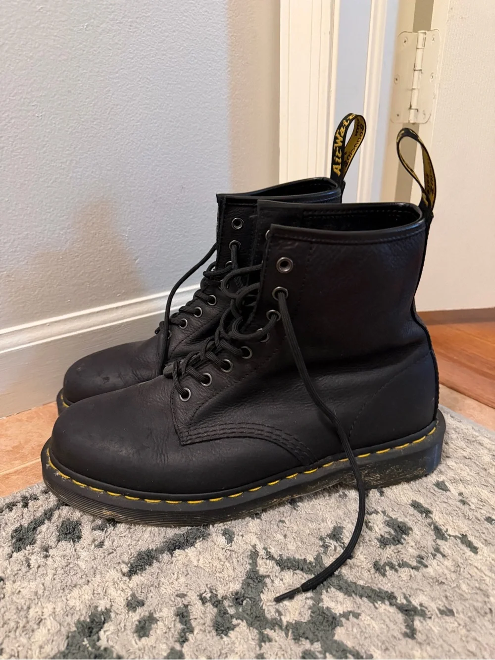Dr. Martens Black Leather 8-Eye Lace-Up Boots with Yellow Stitching